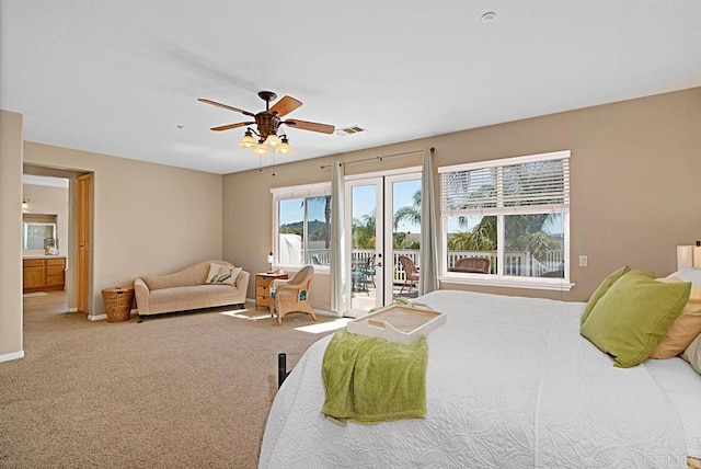 595 S Hidden Trails Rd, Escondido, CA 92027 - carpeted bedroom with access to exterior, ceiling fan, and ensuite bathroom