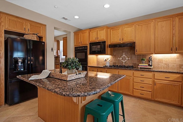 595 S Hidden Trails Rd, Escondido, CA 92027 - kitchen featuring black appliances, tasteful backsplash, a center island, a kitchen breakfast bar, and recessed lighting