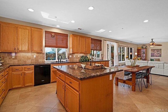 595 S Hidden Trails Rd, Escondido, CA 92027 - kitchen with dishwasher, recessed lighting, decorative backsplash, a center island, and dark stone counters