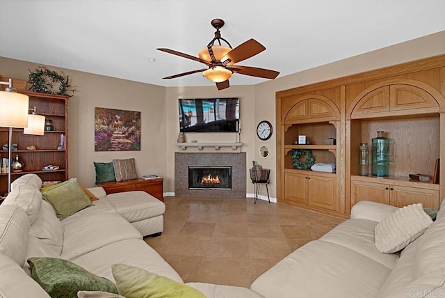595 S Hidden Trails Rd, Escondido, CA 92027 - living area with a tiled fireplace, a ceiling fan, and light tile patterned flooring