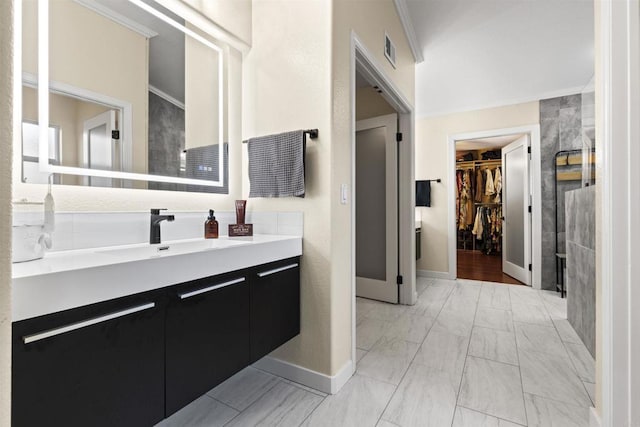 1209 Morgan Hill Dr, Chula Vista, CA 91913 - full bath featuring vanity, a walk in closet, marble finish flooring, and ornamental molding