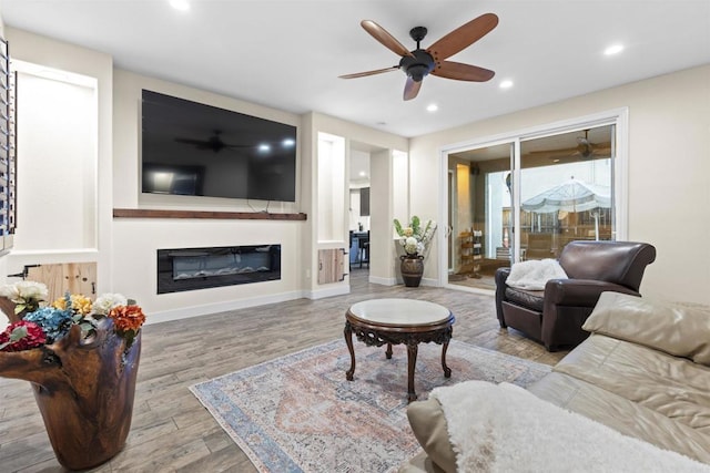 1209 Morgan Hill Dr, Chula Vista, CA 91913 - living room with ceiling fan, recessed lighting, wood finished floors, and a glass covered fireplace