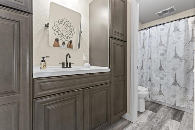1209 Morgan Hill Dr, Chula Vista, CA 91913 - full bathroom with wood finished floors, vanity, a textured wall, and a shower with curtain