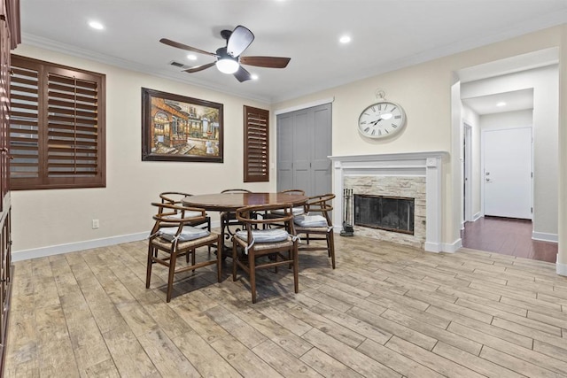 1209 Morgan Hill Dr, Chula Vista, CA 91913 - dining area featuring a ceiling fan, light wood-style floors, crown molding, a glass covered fireplace, and recessed lighting