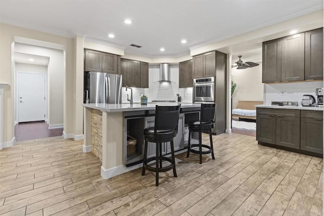 1209 Morgan Hill Dr, Chula Vista, CA 91913 - kitchen with freestanding refrigerator, light countertops, light wood-style floors, backsplash, and ornamental molding
