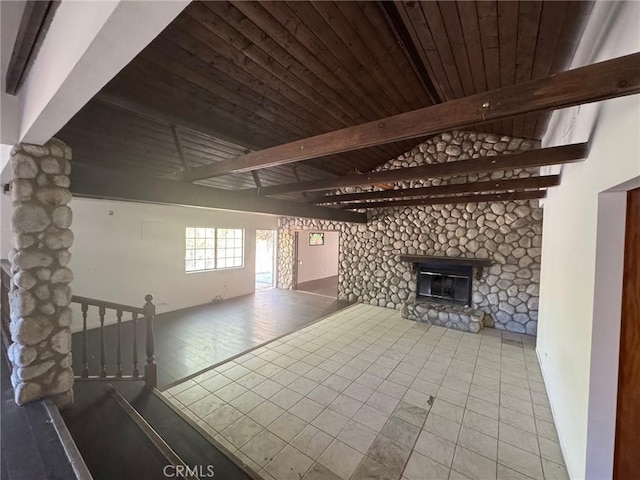 28869 Paradise Rd, Castaic, CA 91384 - unfurnished living room with a wood ceiling with exposed beams, a glass covered fireplace, and tile patterned floors