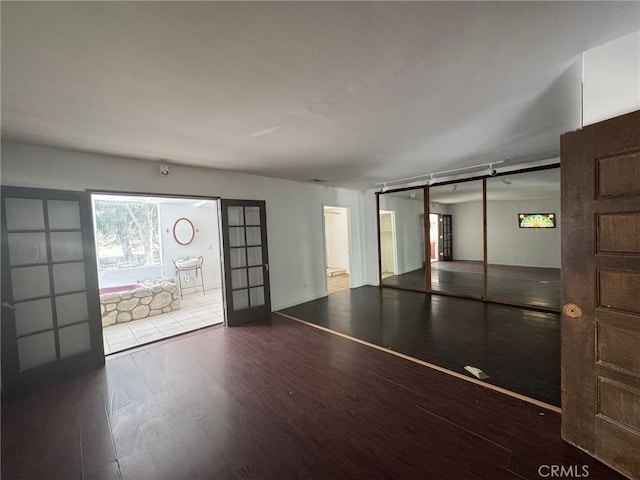 28869 Paradise Rd, Castaic, CA 91384 - unfurnished living room with wood finished floors and french doors