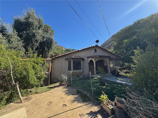 28869 Paradise Rd, Castaic, CA 91384 - view of front of house featuring stucco siding and a tile roof