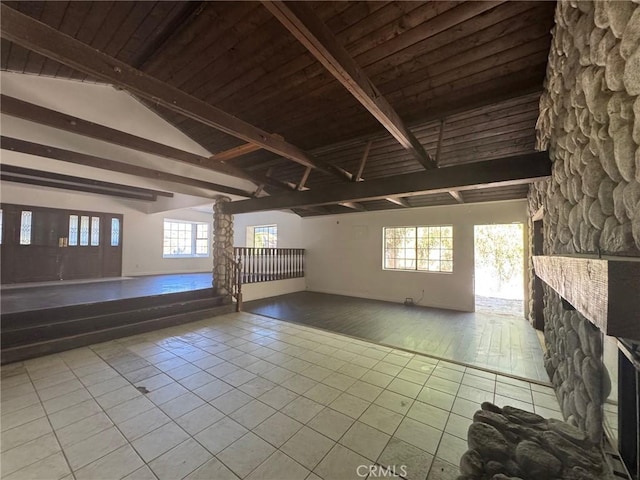 28869 Paradise Rd, Castaic, CA 91384 - unfurnished room with tile patterned floors, a stone fireplace, and wooden ceiling