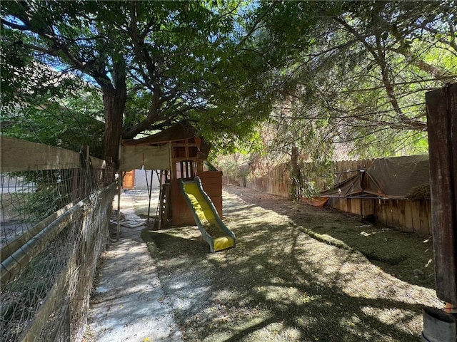 28869 Paradise Rd, Castaic, CA 91384 - fenced backyard featuring a playground