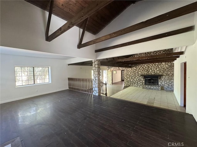 28869 Paradise Rd, Castaic, CA 91384 - unfurnished living room with a fireplace, beamed ceiling, wood finished floors, and high vaulted ceiling