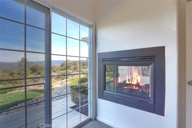 31008 Longview Ln E, Coarsegold, CA 93614 - detailed view of a textured wall, a mountain backdrop, and a multi sided fireplace