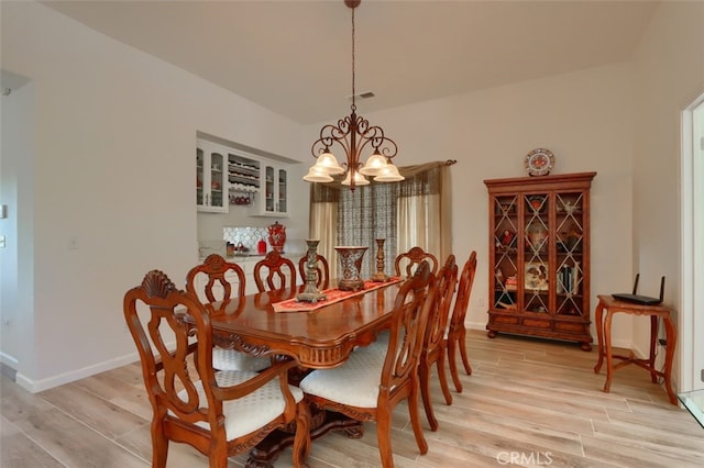 31008 Longview Ln E, Coarsegold, CA 93614 - dining room featuring a chandelier and light wood-style floors