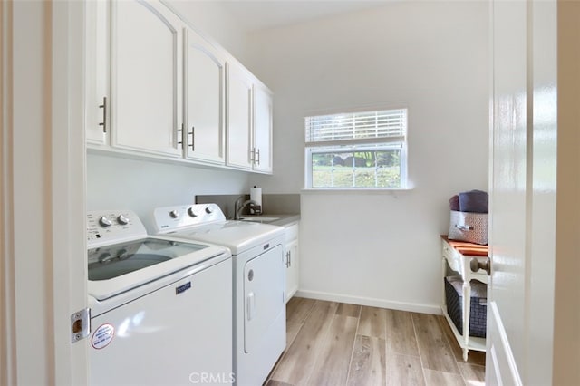 31008 Longview Ln E, Coarsegold, CA 93614 - washroom with cabinet space, washing machine and clothes dryer, and light wood finished floors
