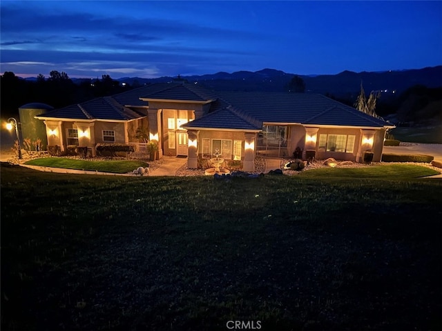 31008 Longview Ln E, Coarsegold, CA 93614 - prairie-style home featuring a front yard, a tiled roof, and stucco siding
