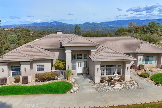 31008 Longview Ln E, Coarsegold, CA 93614 - view of front of property featuring a tiled roof, a mountain view, stucco siding, and a chimney