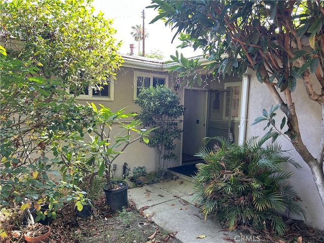 1021 E Gaillard St, Azusa, CA 91702 - property entrance featuring stucco siding