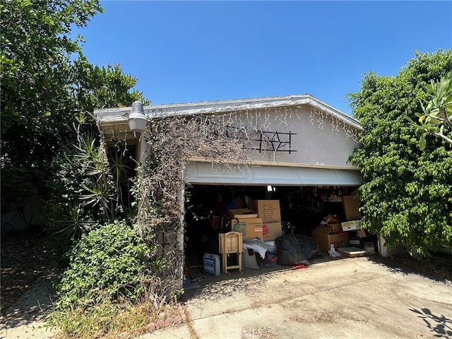 1021 E Gaillard St, Azusa, CA 91702 - view of front facade with a garage and driveway