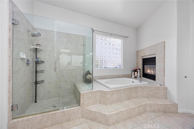 403 Stone Cross Dr, Bakersfield, CA 93312 - bathroom featuring a bath, a stall shower, a tile fireplace, and tile patterned floors