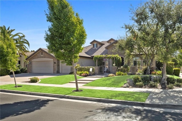 403 Stone Cross Dr, Bakersfield, CA 93312 - view of property hidden behind natural elements with stone siding, a front yard, driveway, a tiled roof, and stucco siding