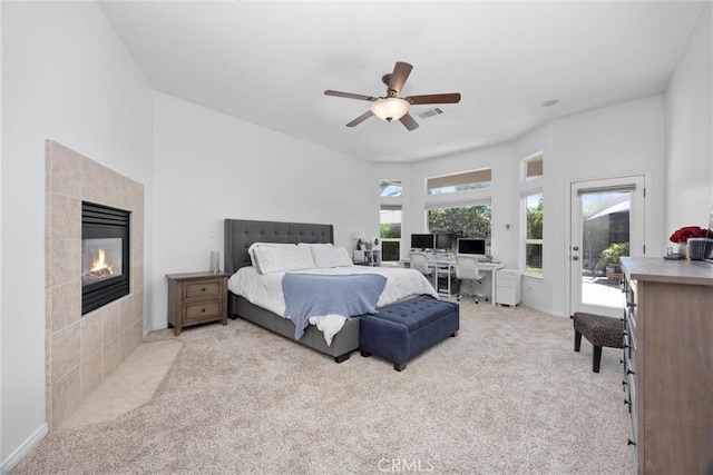 403 Stone Cross Dr, Bakersfield, CA 93312 - bedroom featuring access to outside, a tiled fireplace, carpet, a ceiling fan, and an office area
