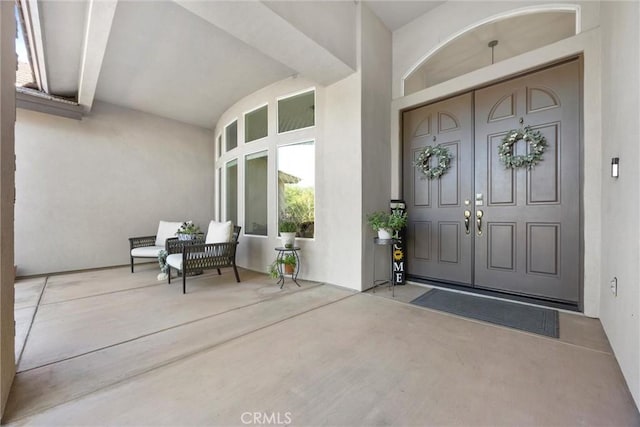 403 Stone Cross Dr, Bakersfield, CA 93312 - doorway to property featuring stucco siding and a porch