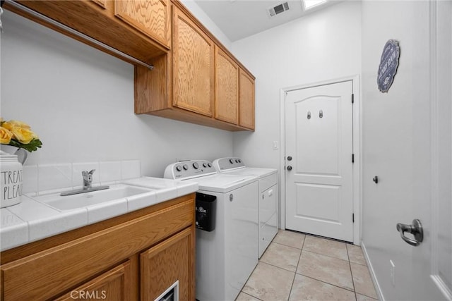 403 Stone Cross Dr, Bakersfield, CA 93312 - laundry room with cabinet space, washer and dryer, and light tile patterned floors