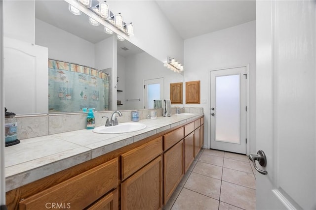 403 Stone Cross Dr, Bakersfield, CA 93312 - bathroom featuring double vanity, tile patterned floors, and a shower with curtain