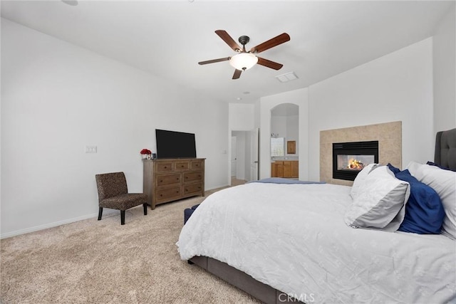 403 Stone Cross Dr, Bakersfield, CA 93312 - carpeted bedroom with a fireplace, ceiling fan, and arched walkways