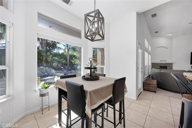 403 Stone Cross Dr, Bakersfield, CA 93312 - dining space featuring light tile patterned flooring and a fireplace