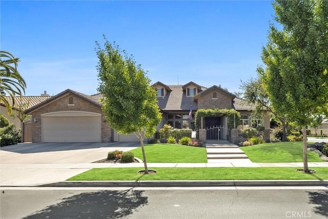 403 Stone Cross Dr, Bakersfield, CA 93312 - view of front facade with stone siding, an attached garage, concrete driveway, and a front lawn