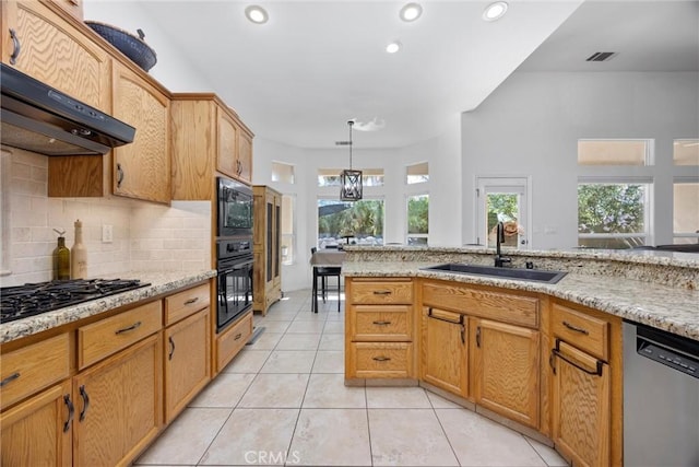 403 Stone Cross Dr, Bakersfield, CA 93312 - kitchen with black appliances, backsplash, light tile patterned floors, recessed lighting, and light stone countertops