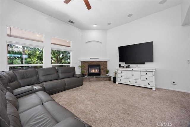 403 Stone Cross Dr, Bakersfield, CA 93312 - living area featuring carpet floors, a ceiling fan, and a fireplace