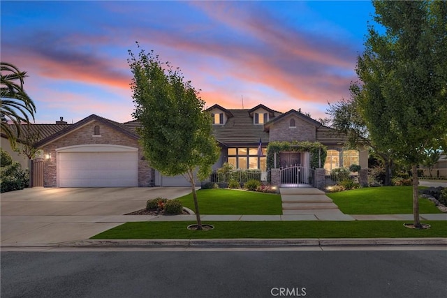 403 Stone Cross Dr, Bakersfield, CA 93312 - view of front of property with stone siding, concrete driveway, a garage, a lawn, and a tiled roof