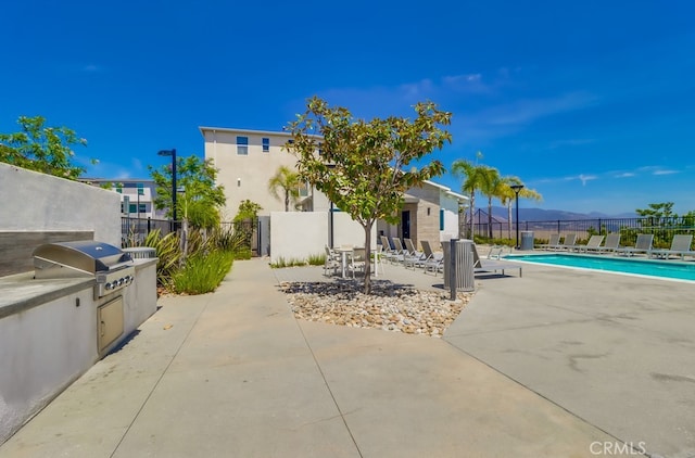 1905 Soho Ln Unit 2, Chula Vista, CA 91915 - view of patio / terrace with a community pool and area for grilling