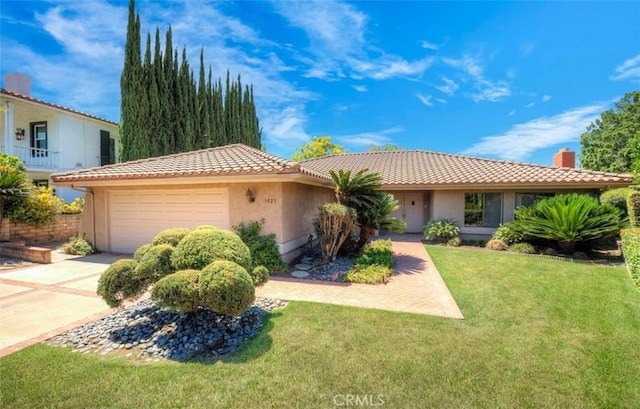 1023 Don Pablo Dr, Arcadia, CA 91006 - view of front of property with an attached garage, a chimney, concrete driveway, a front yard, and stucco siding