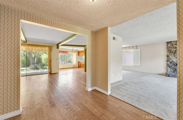 1023 Don Pablo Dr, Arcadia, CA 91006 - spare room featuring a textured ceiling, wood finished floors, and wallpapered walls