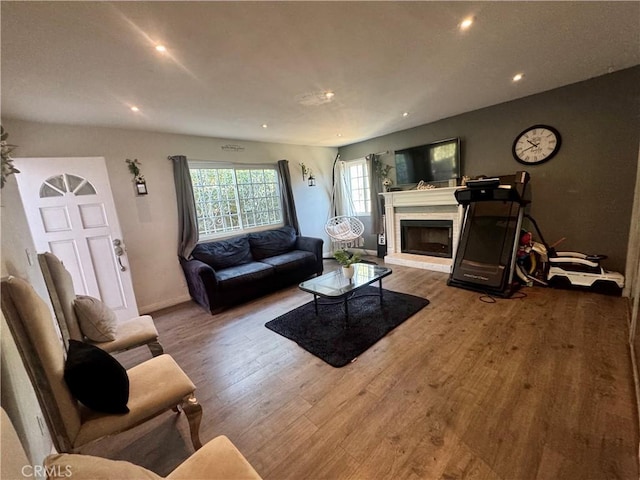 1203 W 134th Pl, Compton, CA 90222 - living area featuring wood finished floors, recessed lighting, and a brick fireplace