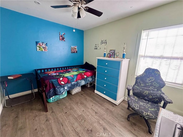 1203 W 134th Pl, Compton, CA 90222 - bedroom with wood finished floors and a ceiling fan
