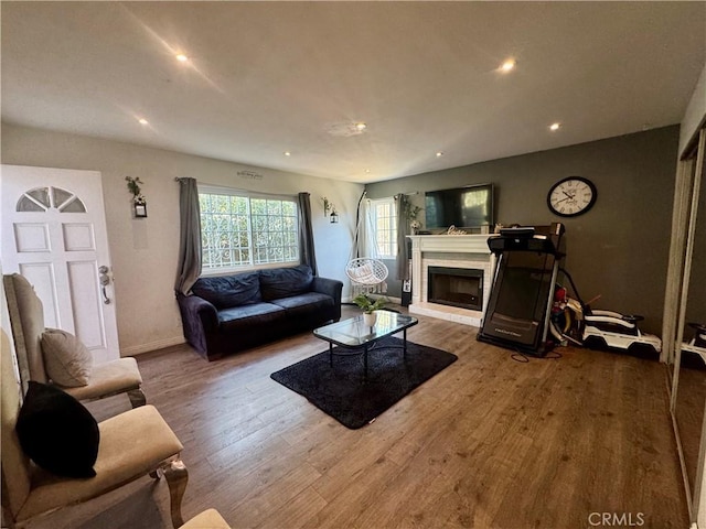 1203 W 134th Pl, Compton, CA 90222 - living room with wood finished floors, recessed lighting, and a brick fireplace
