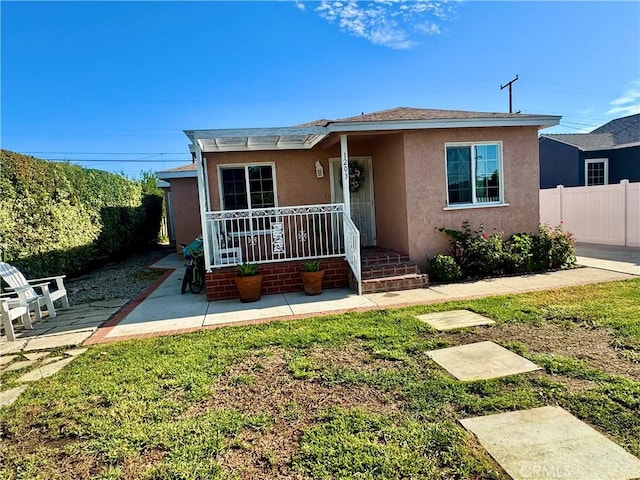 1203 W 134th Pl, Compton, CA 90222 - view of front of home featuring stucco siding and a patio area