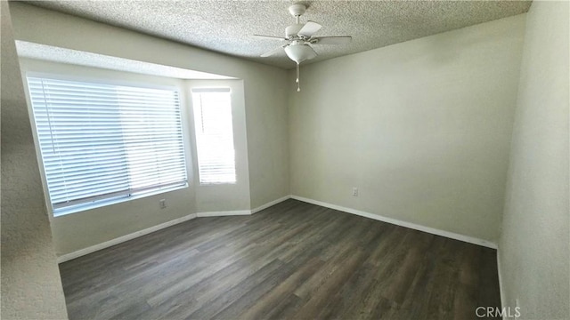 37432 Whitehall Ln, Palmdale, CA 93550 - empty room with dark wood-style flooring, ceiling fan, and a textured ceiling
