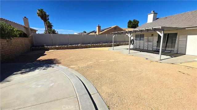 37432 Whitehall Ln, Palmdale, CA 93550 - fenced backyard with a patio and a pergola