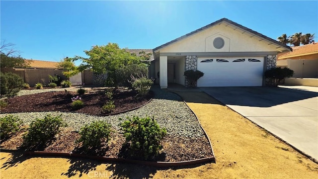 37432 Whitehall Ln, Palmdale, CA 93550 - ranch-style house with concrete driveway, an attached garage, stone siding, and stucco siding