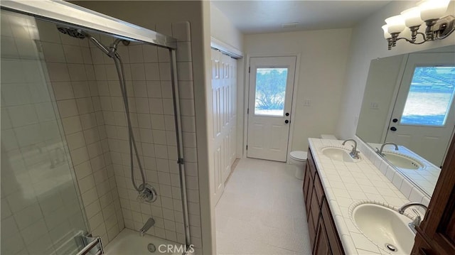 5335 Play Doe Ln, Paso Robles, CA 93446 - bathroom with healthy amount of natural light, double vanity, enclosed tub / shower combo, and a chandelier