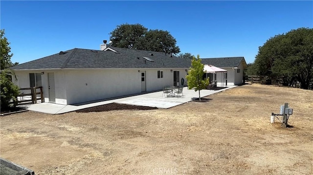 5335 Play Doe Ln, Paso Robles, CA 93446 - rear view of property featuring a patio, stucco siding, and a chimney