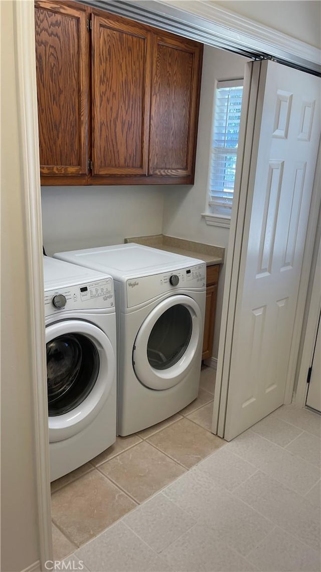 5335 Play Doe Ln, Paso Robles, CA 93446 - washroom featuring cabinet space, washer and clothes dryer, and light tile patterned floors