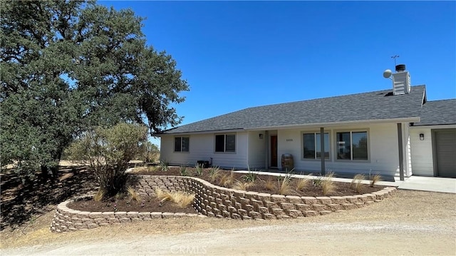 5335 Play Doe Ln, Paso Robles, CA 93446 - ranch-style home with concrete driveway, a garage, roof with shingles, and a chimney