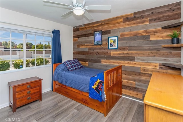 3640 Rosalie St, Simi Valley, CA 93063 - bedroom featuring wood walls, wood finished floors, and ceiling fan