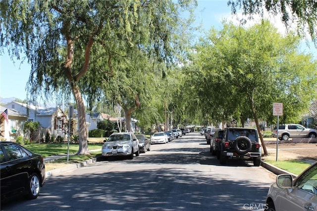 836 N 10th Ave, Upland, CA 91786 - view of asphalt street featuring curbs, sidewalks, and a residential view
